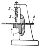 SLIDE OF A HOLE PUNCHING PRESS