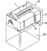 Tray of the ice machine in emptying position